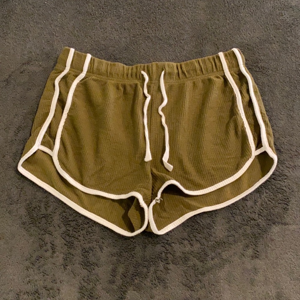 Army green shorts with white detailing